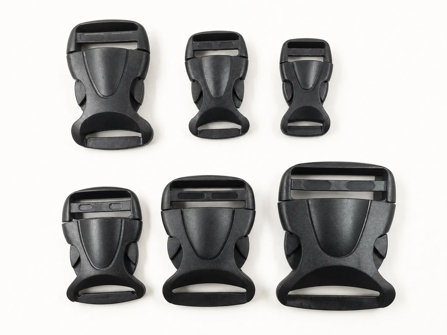 Contoured black plastic side release buckles in several sizes