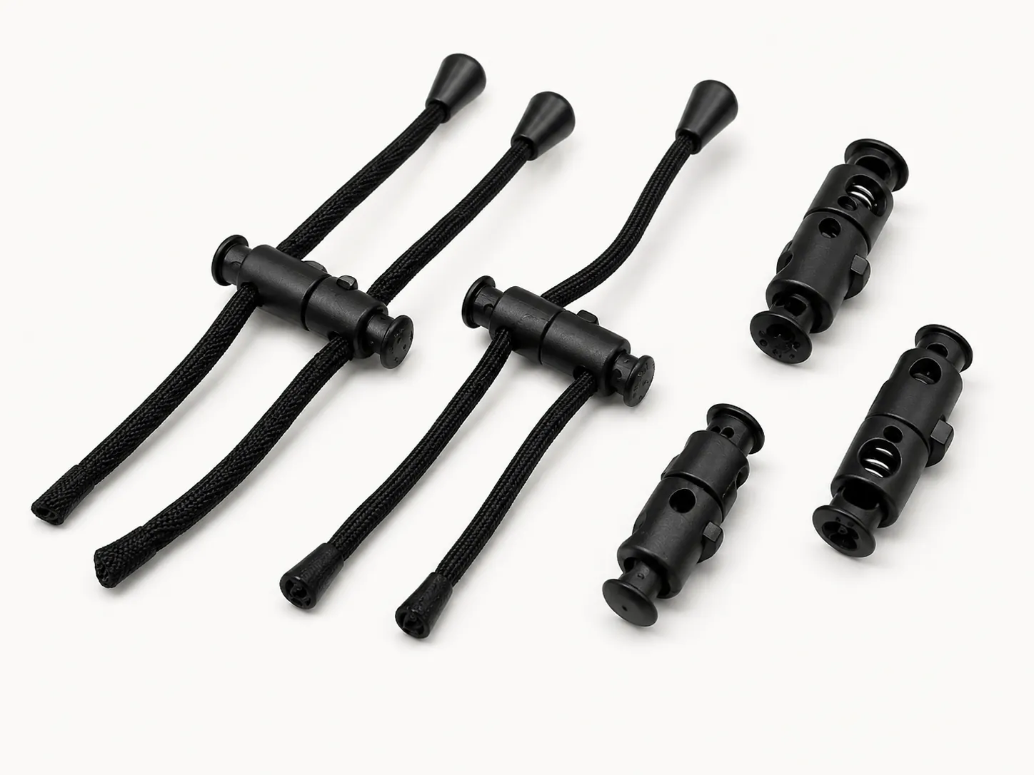 Assembled black drawcord stopper locks with cords and finished cord tips