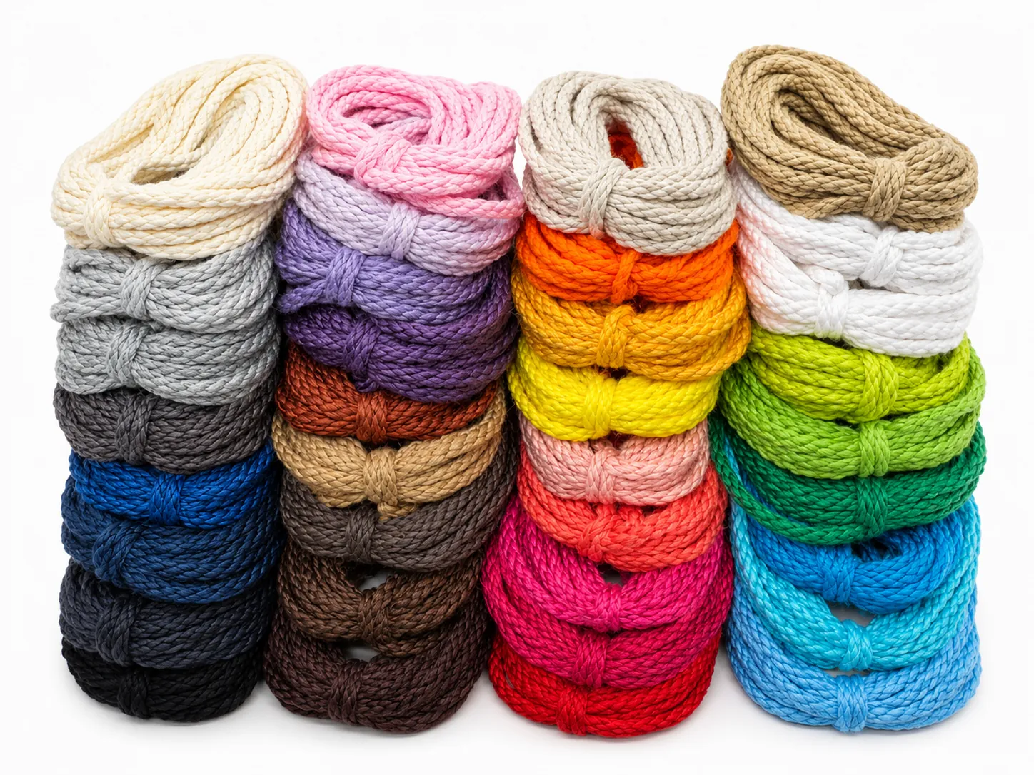 Stacks of colorful braided cotton rope bundles