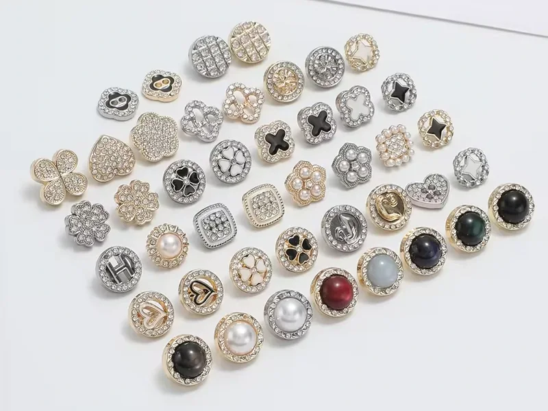 curated crystal button collection in gold and silver finishes