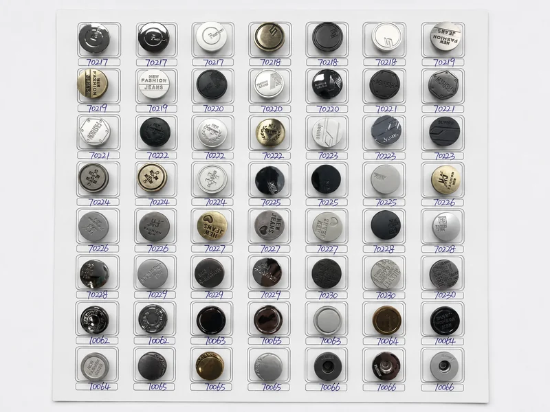 numbered sample board of custom jeans button logo caps and finishes
