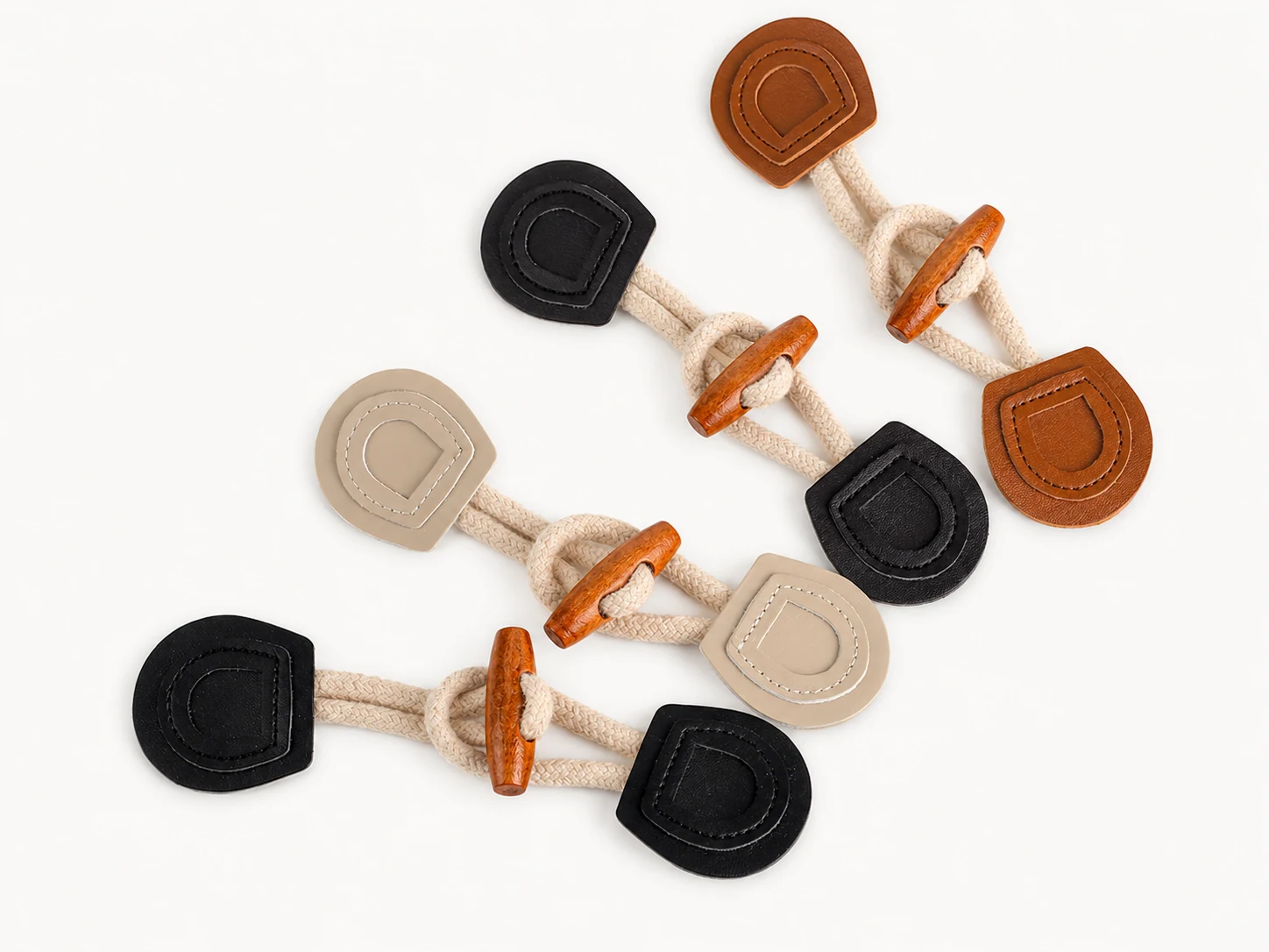rope and leather toggle closures with wooden toggles in beige black and brown colors