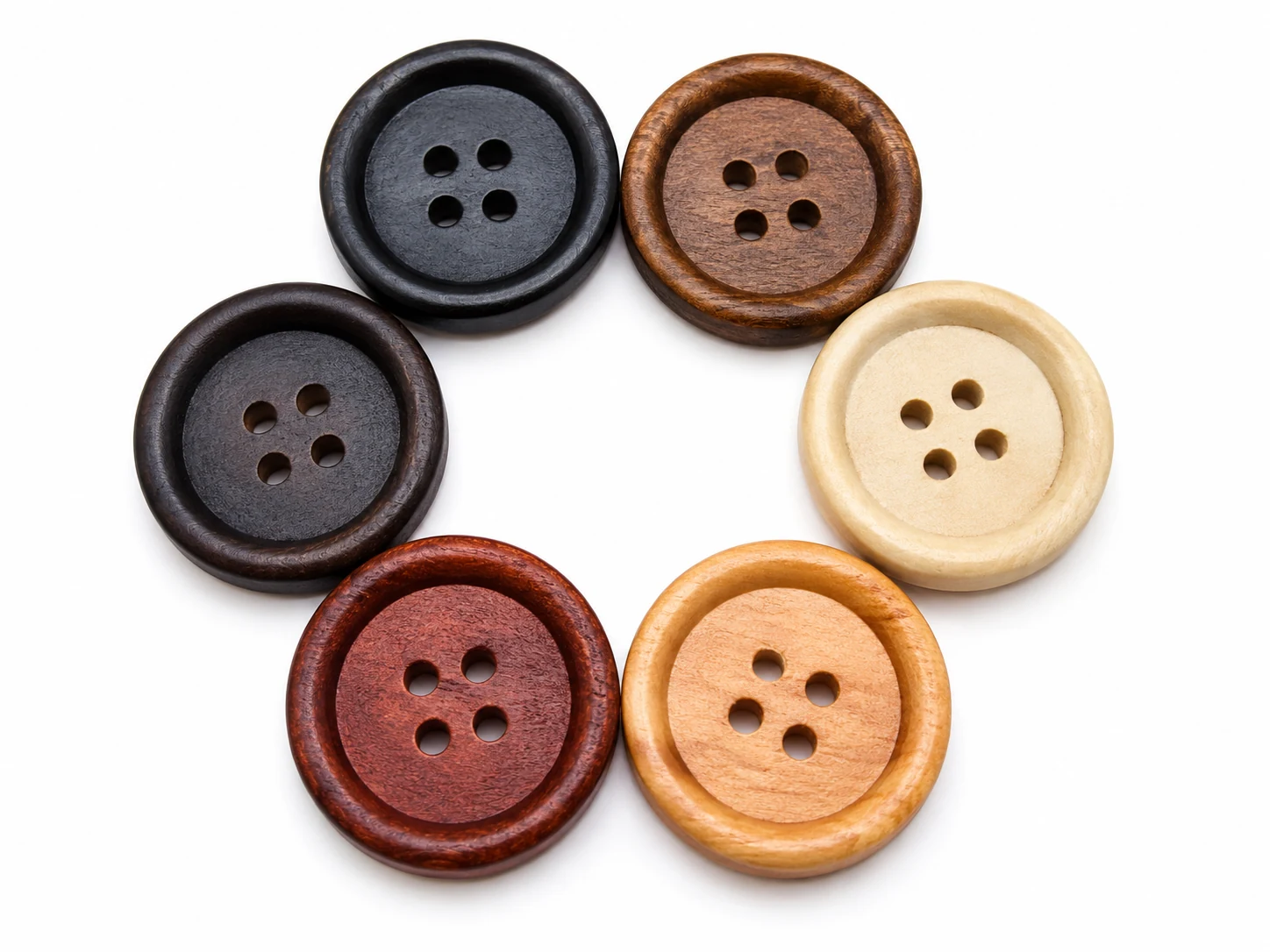 assorted four hole wooden buttons in black brown red brown tan and ivory colors