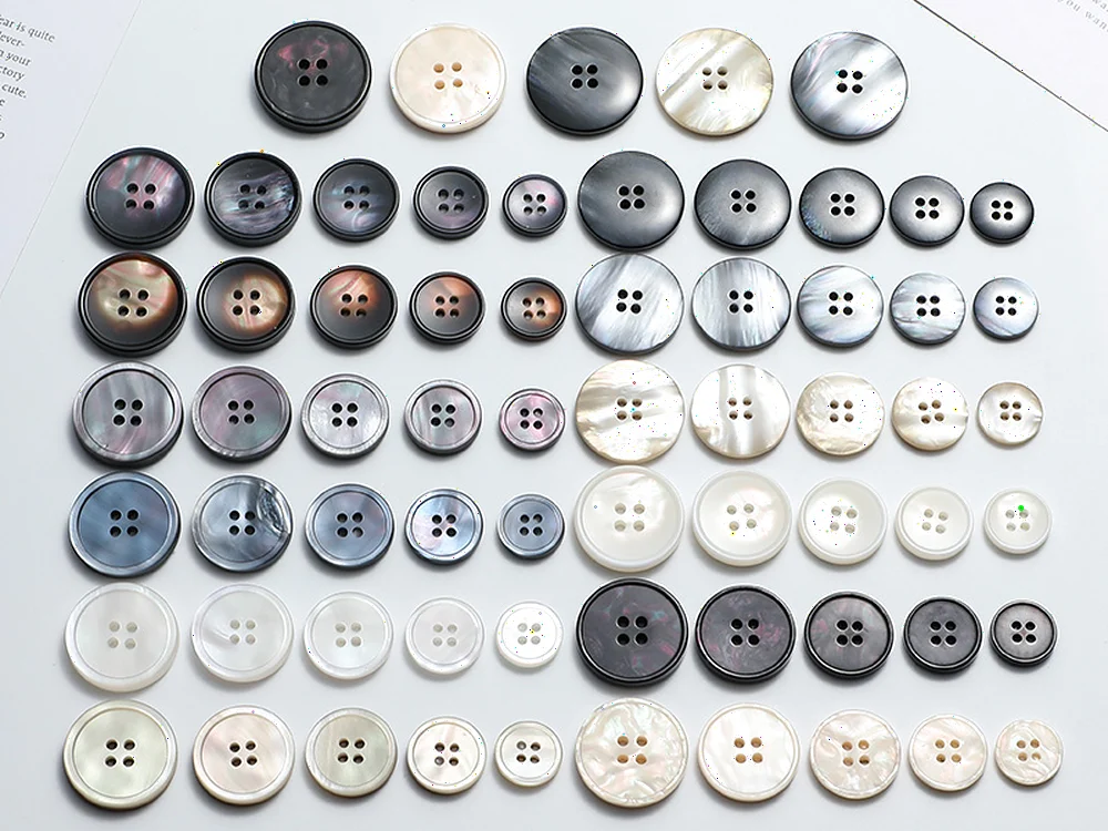 shell-effect polyester button range in black grey ivory and pearl tones
