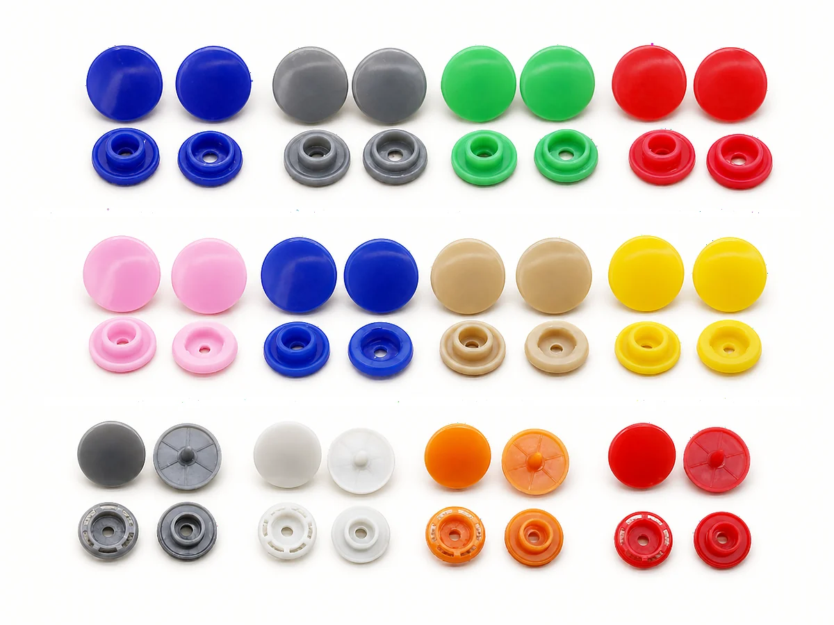 colored plastic snap cap components in blue grey green red pink yellow and white