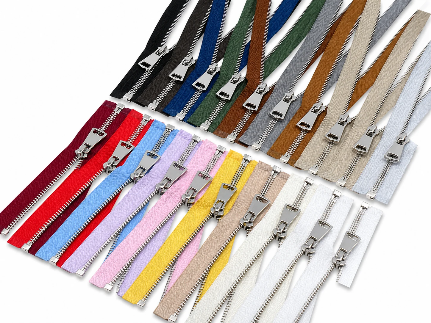 large assortment board of silver metal zippers in many garment tape colors