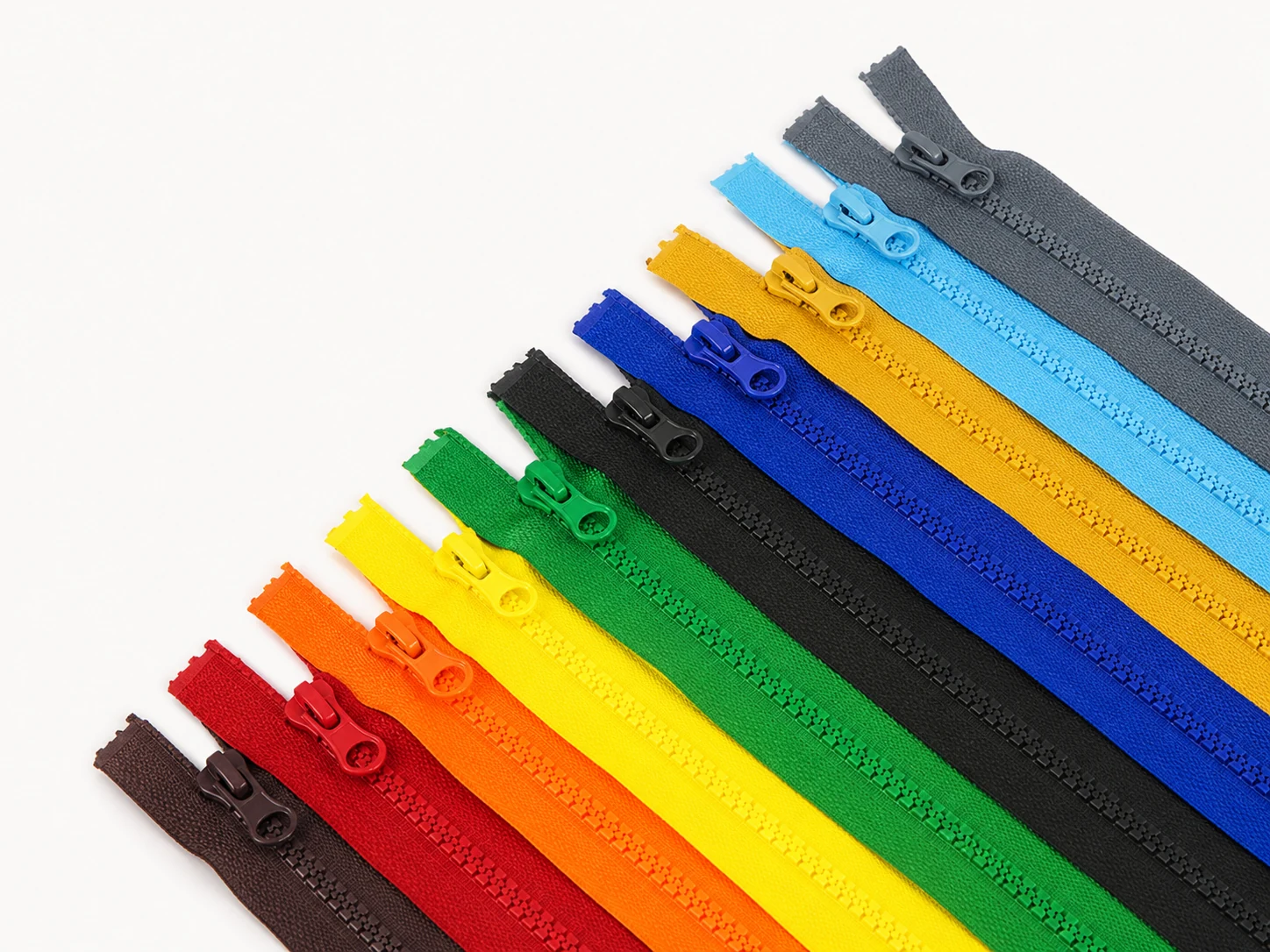 rainbow lineup of molded plastic resin open end zippers