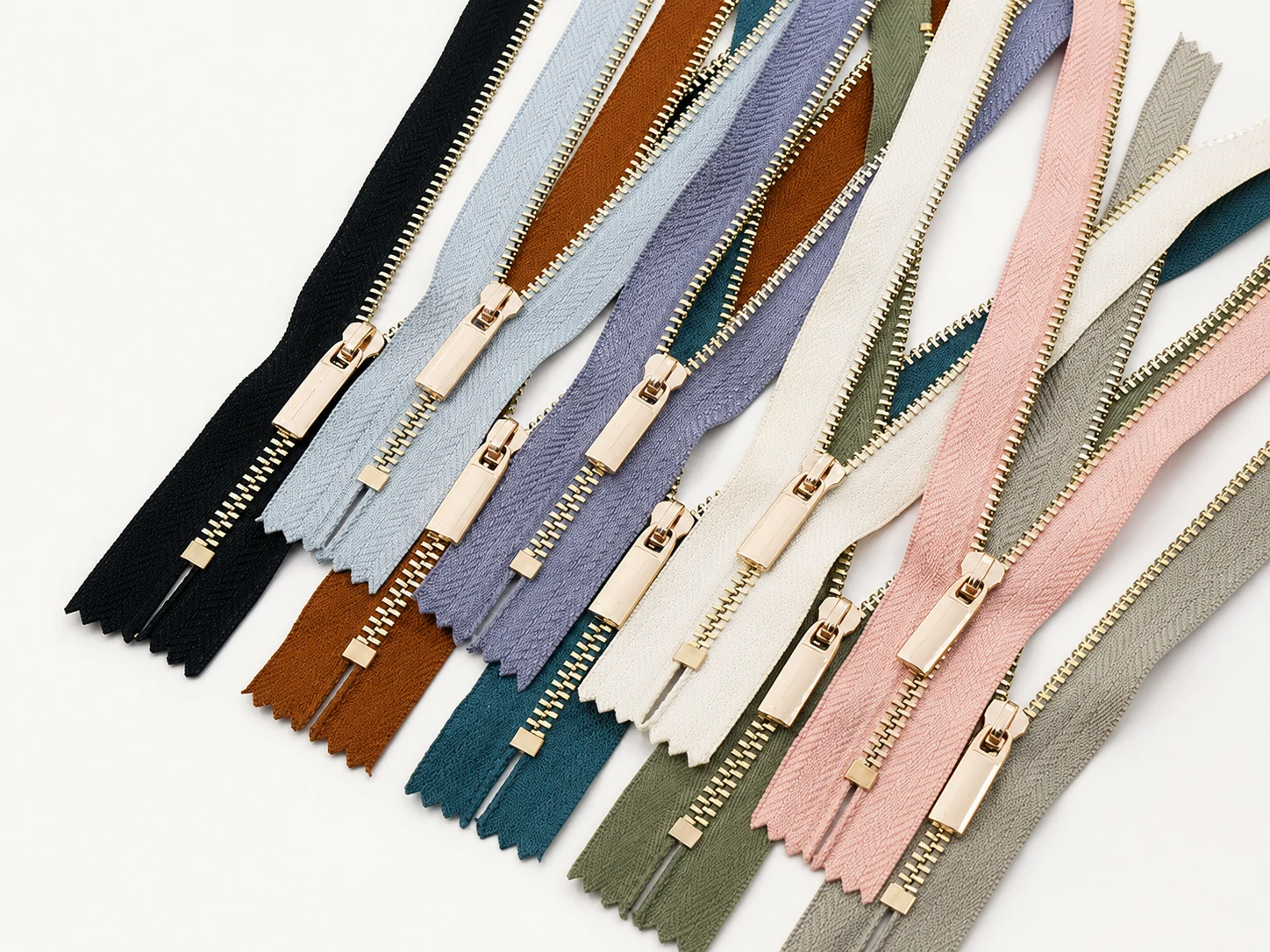 premium metal zippers with gold teeth in muted fashion colors