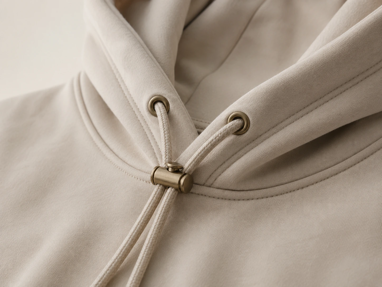 Cord lock and eyelets on a hoodie drawcord